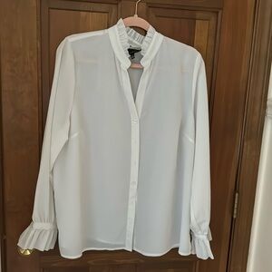 Woman’s white sheer blouse. Worn twice freshly dry cleaned.